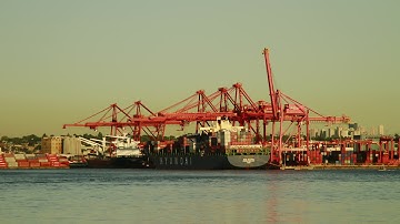 Container Ship Loading Onto Boat. Stock Footage