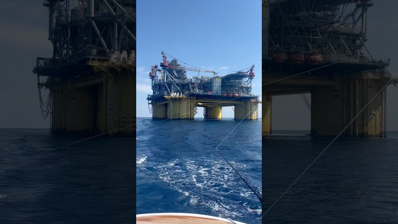 Marlin fishing by an oil rig. 