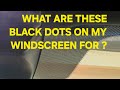 What are the black dots on my windscreen why are they there