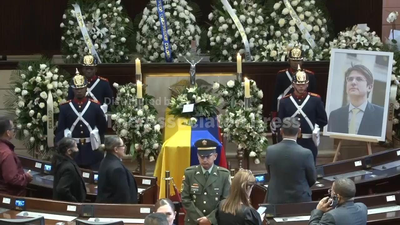Mourners pay respects to late Colombian senator and presidential hopeful as his body lies in state i