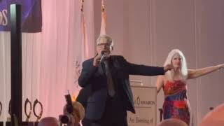 Auctioneer Neil Saffer sells Scott Grody Travel's Cruise on The Fly at The 2024 OPAL Awards