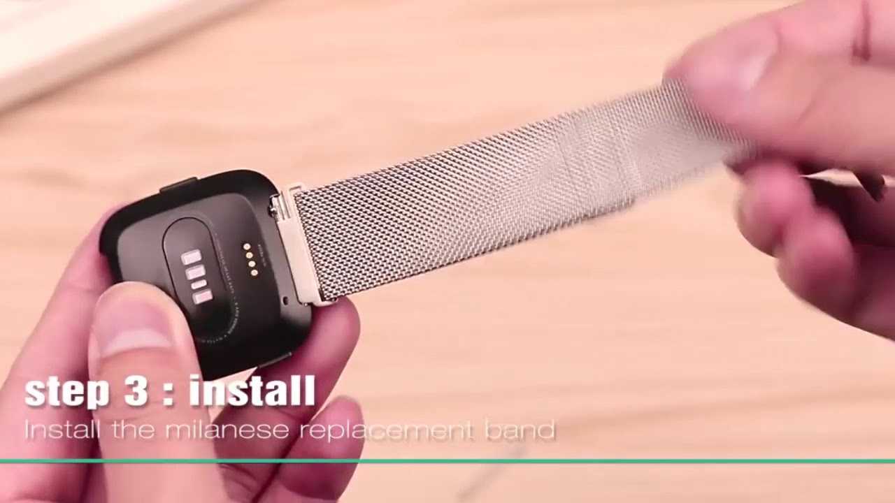 how to put strap on fitbit versa