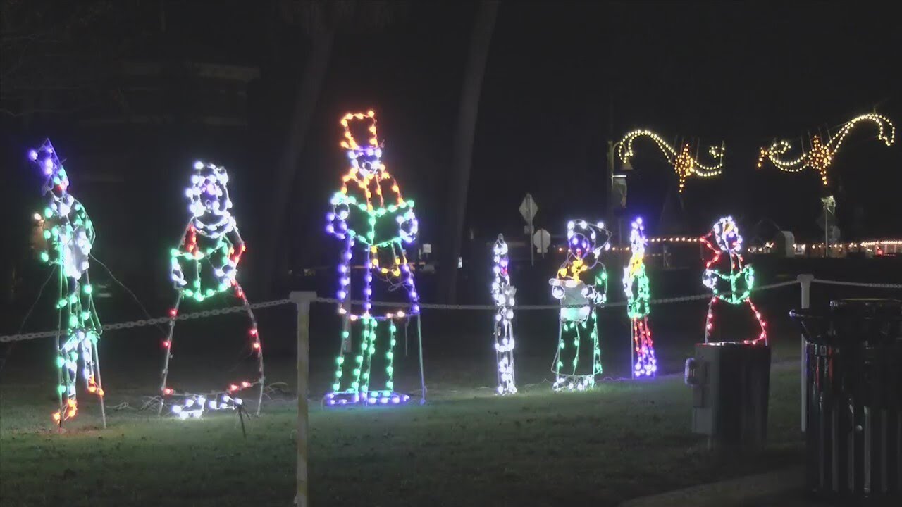 Residents light Christmas tree at Oaks by the Bay YouTube