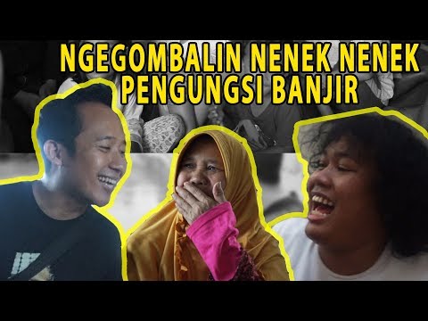 MENGHIBUR PENGUNGSI BANJIR DI KAMPUNG MELAYU