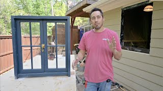 Installing the french casement window I built.