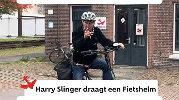 Harry Slinger draagt een fietshelm 
