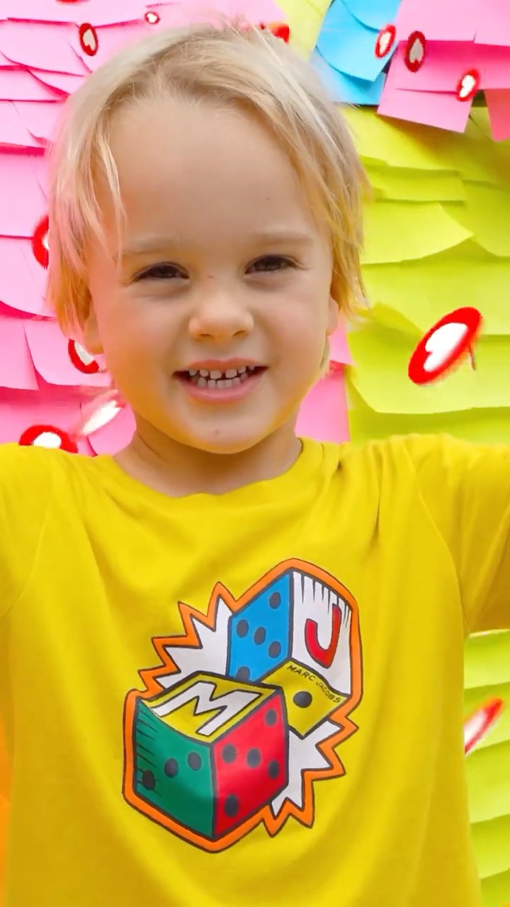 Kids play with stickers and a car