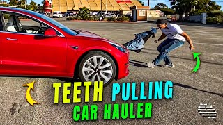 Guy Pulls a Car with His Teeth Connected to 4 Pair of Jeans