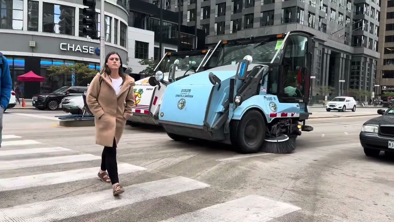 Street Sweepers Cleaning Up After Parade