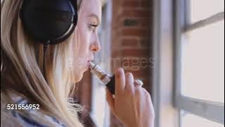 Woman With Vape and Headphones