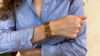 Vidéo: Bracelet Hermes Ouvrant Email imprimé en métal doré (moyen modèle) 20 mm.