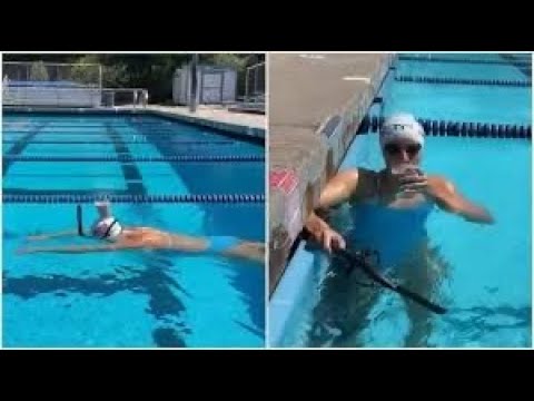 Katie Ledecky Takes a Swim with Glass of Chocolate Milk Atop Her ...