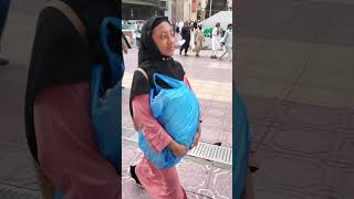 sanika carries bag to hotel at Mecca