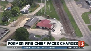 Former fire chief accused