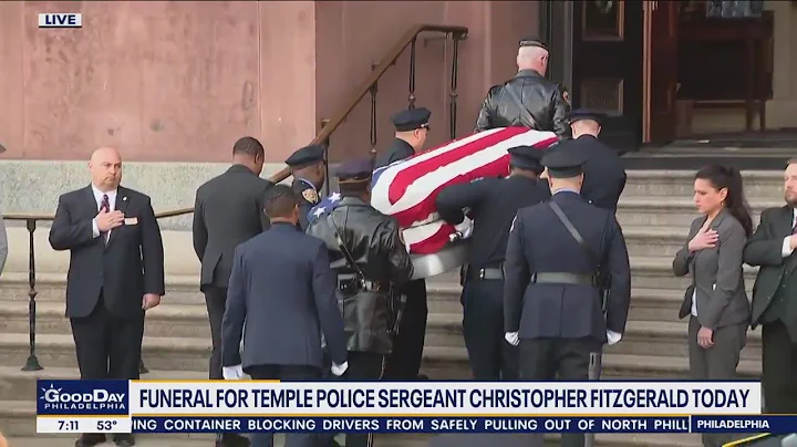 Police procession leads casket to church for funer...