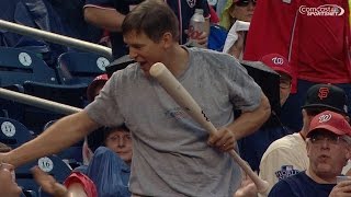 Fan catches bat on the fly, gets a kiss