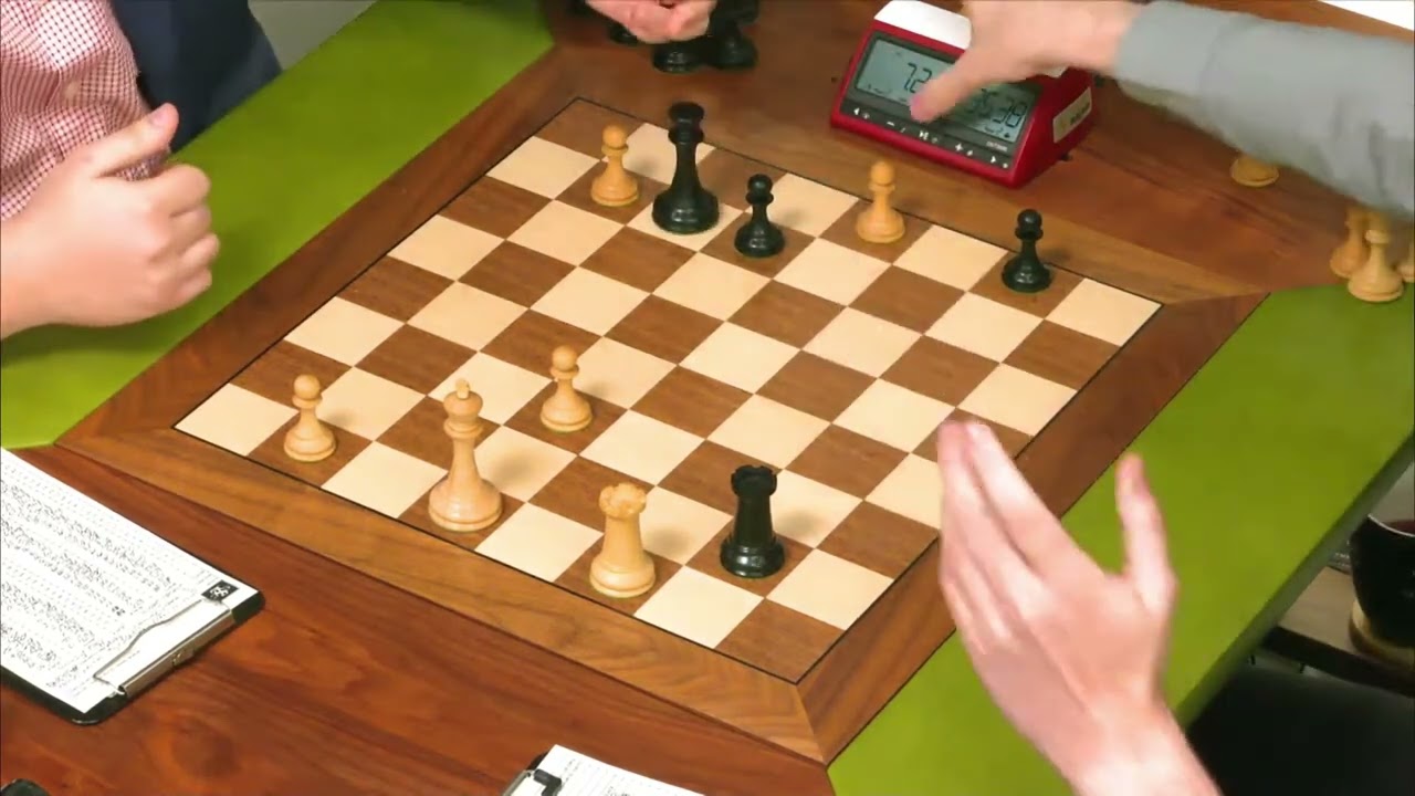 Hans Niemann's king occupying 4 squares at once. Isn't it unfair in a blitz  scramble for the opponent that he pressed the clock in this position? : r/ chess