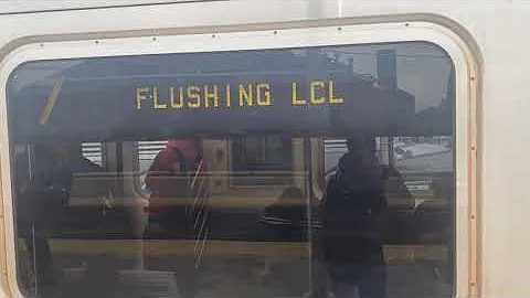 IRT Flushing line: Mets Willets Point bound R188 7 local train leaving Junction Blvd