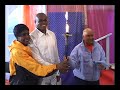 2006 Peace Torch held by Sudhahota Carl Lewis and his mother Ambalika Evelyn Lawler with Sri Chinmoy