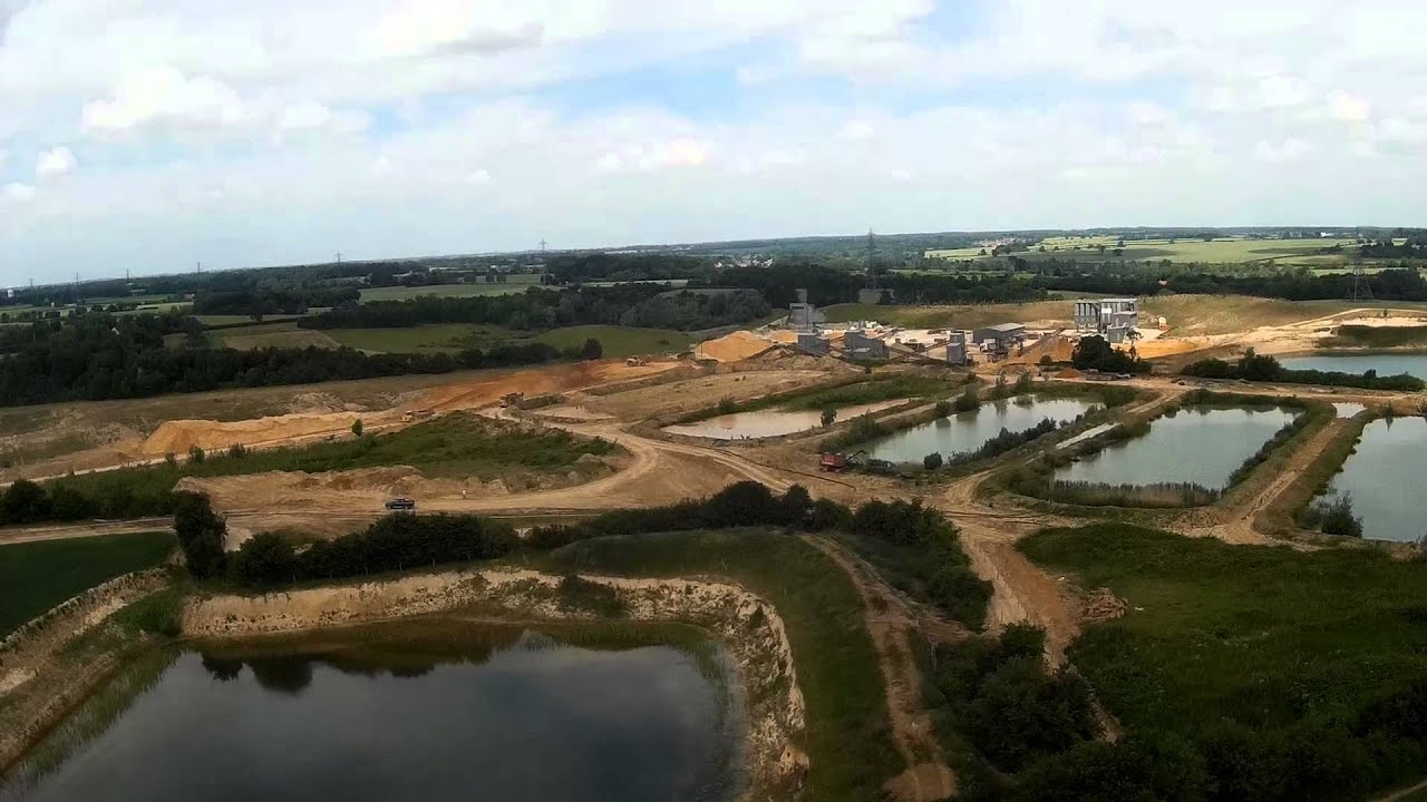 HK FPV250 over another lake and quarried former WW2 airfield.
