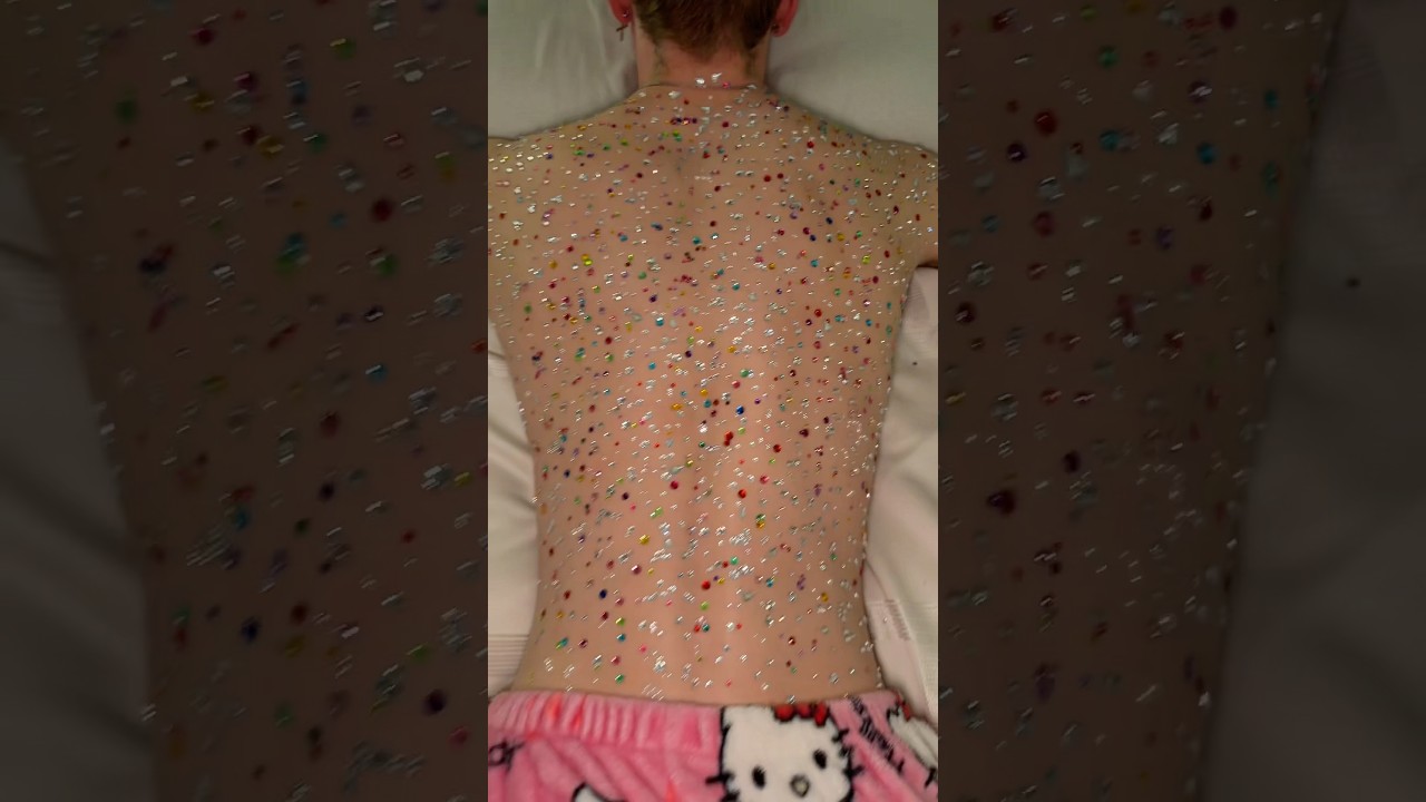 Decorating my boyfriends back with sparkles 