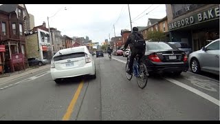 Cyclists lose bike lanes to parked cars - Toronto's increasing problem
