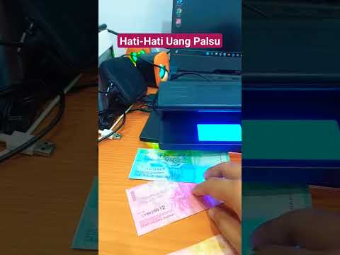 Senter cek uang asli vs palsu