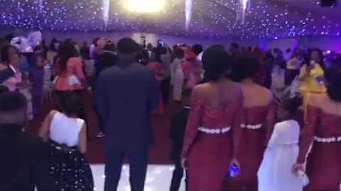 Charles Emeka & guests wait on the bride and groom