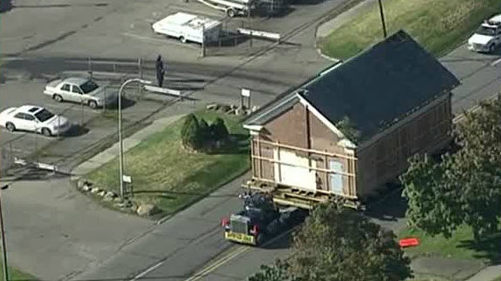 Historic schoolhouse moved to new home