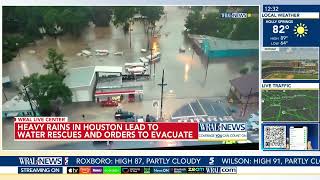 Heavy rains near Houston close schools and flood roadways as officials urge residents to evacuate