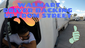 Walmart driver amazing back up from street to a warehouse