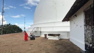 Mihintale, Sri Lanka, November 24, 2019, Mihintale Temple Complex, monk on the background of the