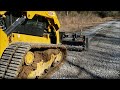 CAT 259D3 grading mile long driveway with Harley Rake Illinois homestead