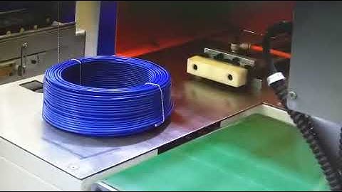 Coil shrink wrapping machine