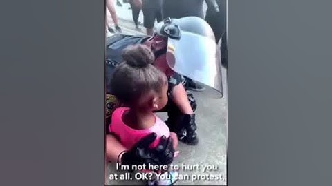 Officer comforts little girl after asking "are you going to shoot us?"🥲