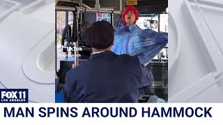 Man refuses to take down hammock on bus