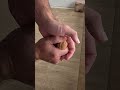 Cracking a walnut with my barehands Partial close up