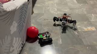 spider robot and tank robot chasing red ball