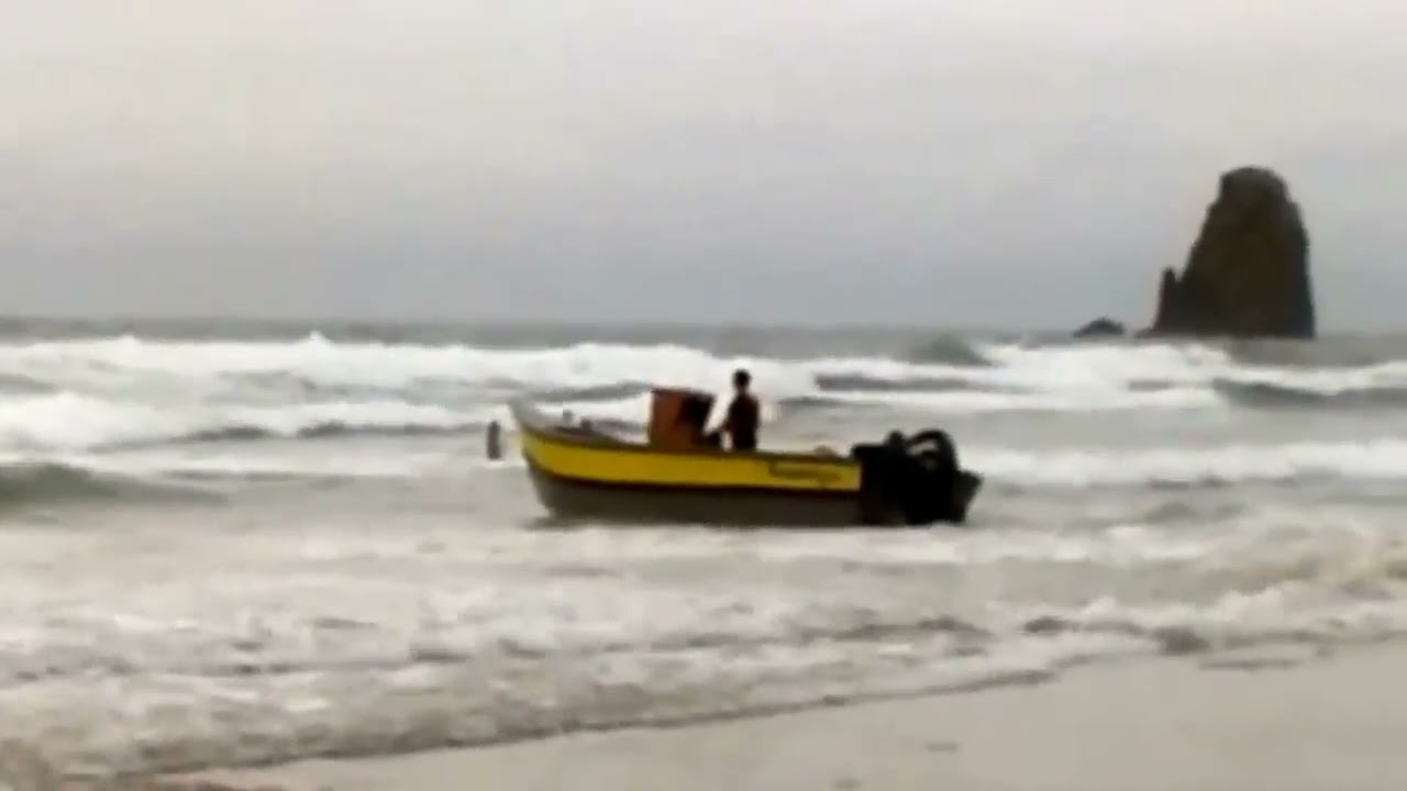 launching a pacific dory in the surf - youtube