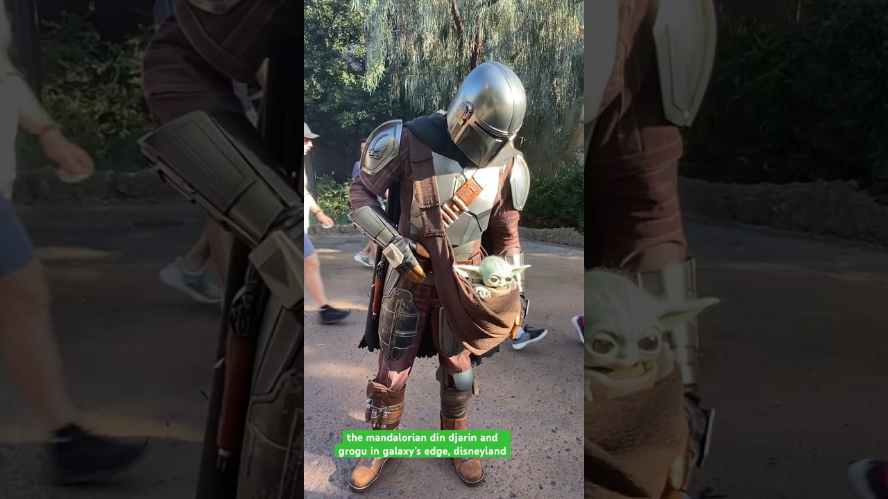 the mandalorian din djarin and grogu in galaxy’s edge, disneyland 