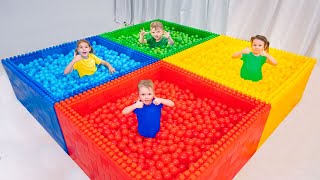 Juegos de Vania y Mania en una enorme piscina con bolas de colores | Vídeo para niños