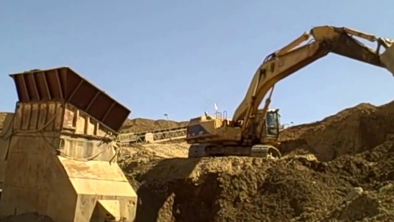 Excavator feeds hopper at Lehigh Hanson's Mission Valley Rock