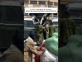 A man escapes police with handcuffs on his hand during todays maandamano