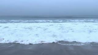 Hypnotic Tides at Day Break on a Grey Coastal Morning