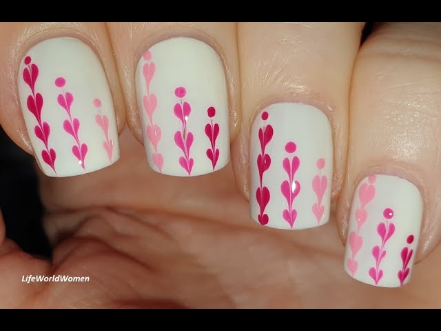 Gel nail design. French pink-white manicure with drawings, flowers and  monograms on short square nails close-up on a white background. Stock Photo  | Adobe Stock