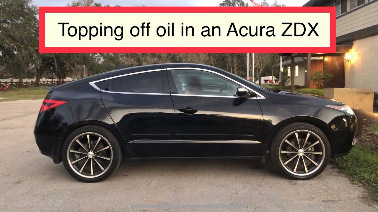 Topping off engine oil on Acura ZDX in between oil changes. - YouTube