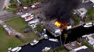 50 firefighters work to put out boat fires in Miami