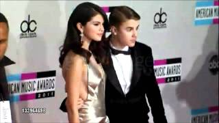 Selena gomez & justin bieber walking the red carpet at american music
awards 2011