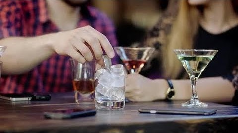 Putting Ice Into Drink Stock Video