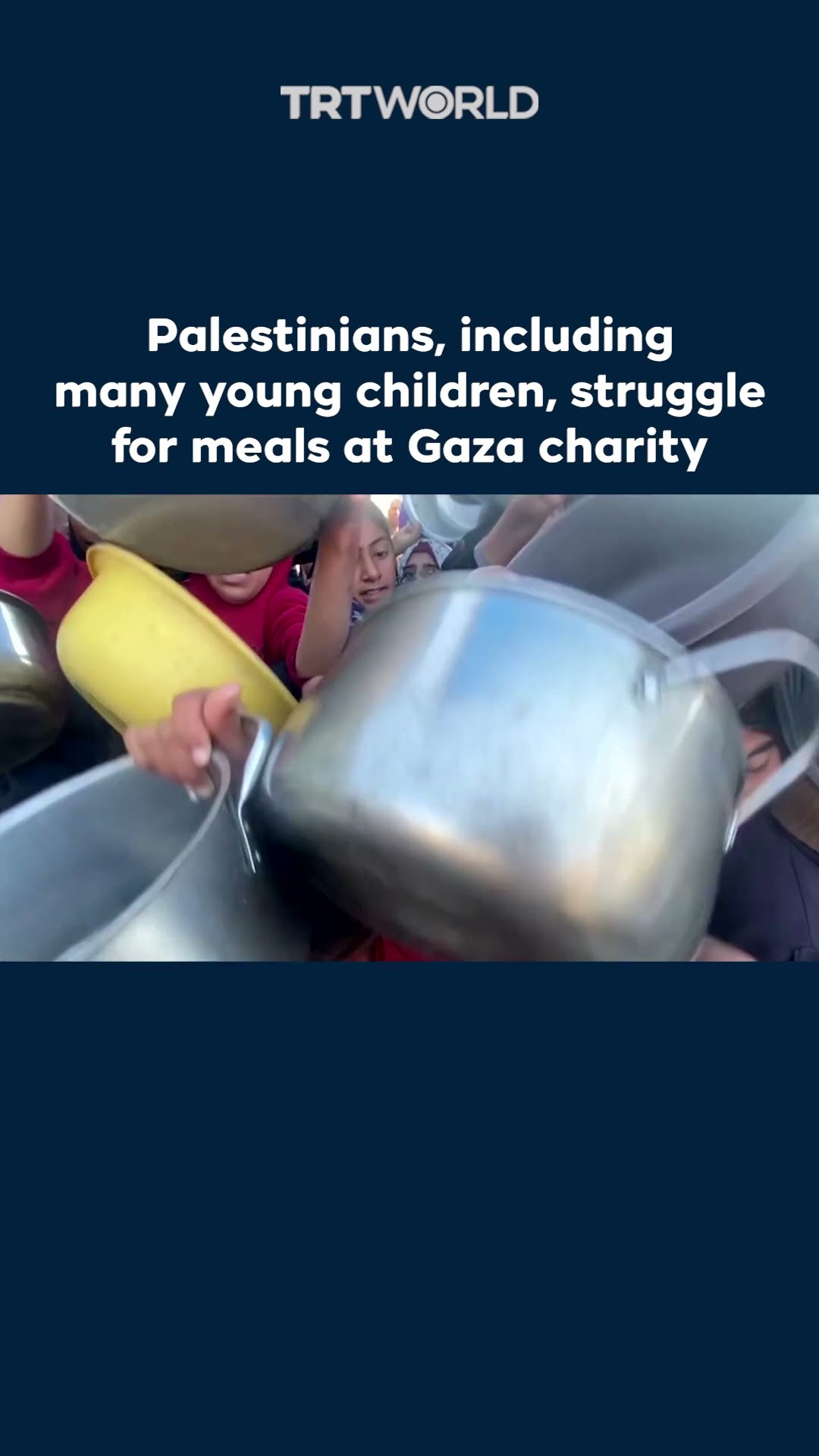 Palestinians struggle to receive meals at a charity kitchen in Gaza